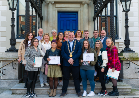 16 people from the community after schools Project Awards, recieving awards